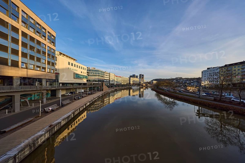 River Saar, modern architecture, trees, reflections on the water surface, fashion shop, Primark, evening light, blue sky, cirrostratus clouds, footbridge, Berlin Promenade, Willi Graf Ufer, Saarbrücken, state capital, Saarbrücken Regional Association, Saarland, Germany, Europe