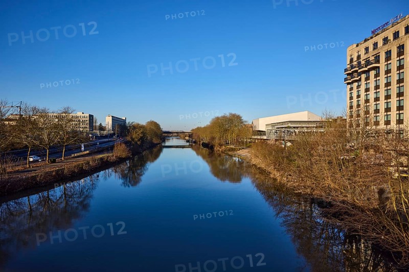 River Saar, trees, modern architecture, concrete architecture, Mercure Hotel, reflections on the water surface, blue cloudless sky, Saarbrücken, state capital, regional association Saarbrücken, Saarland, Germany, Europe
