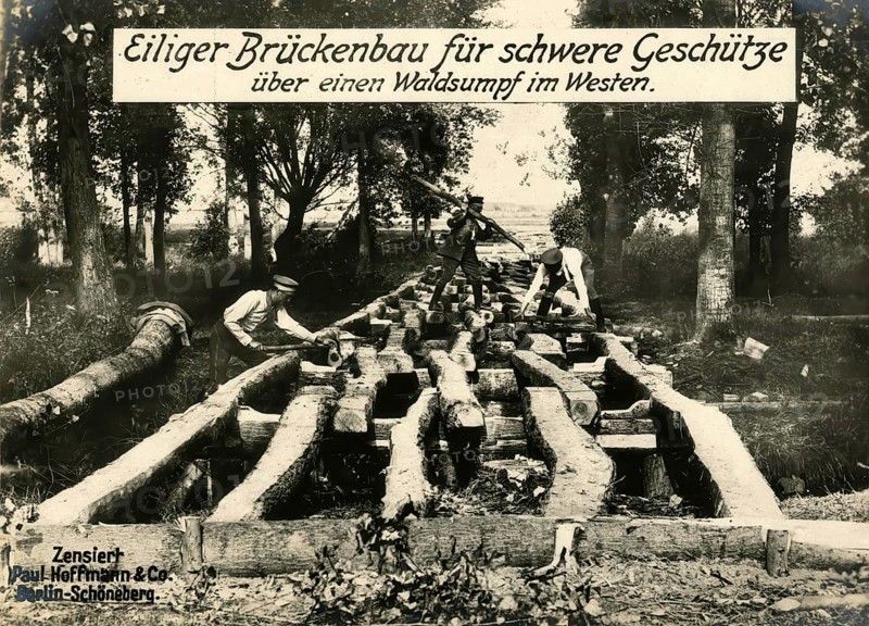 Hasty bridge construction for heavy guns over a forest swamp in the west, 1914 - 1918, World War I, reproduction of a war postcard