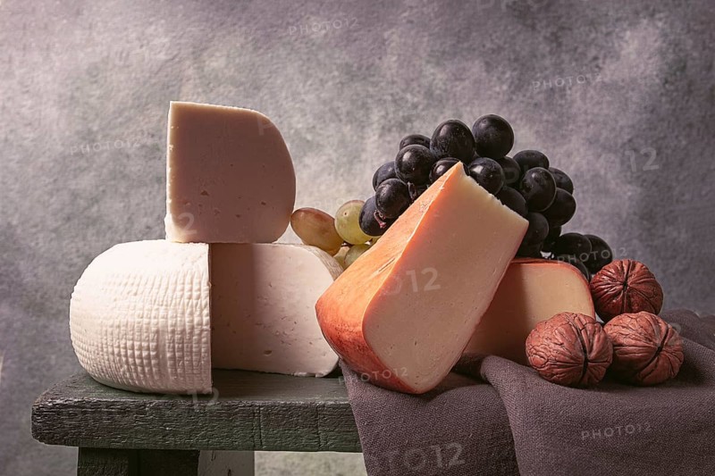 Georgian cheese, Imeretian and smoked suluguni, grapes, nuts, on a cutting board, Georgian cuisine, no people