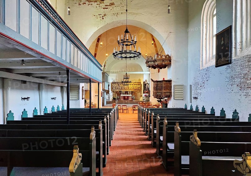Evangelical Lutheran parish church of St. Johannis, view through the nave to the altar, Nieblum, Föhr, Schleswig-Holstein, Germany, Europe