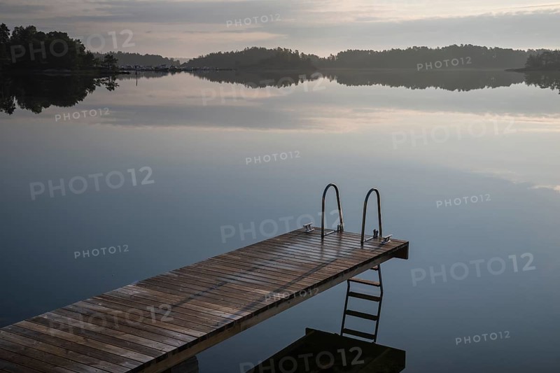 Wooden jetty with ladder, calm water surface, morning atmosphere, Kasnäsintie, Falkö Fjord, Kasnäs, Hitis archipelago, archipelago south of Turku, Finland, Europe