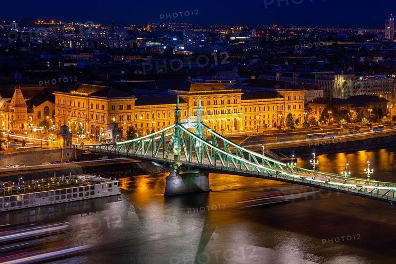 Evening panorama of Budapest with the Danube and the Liberty Bridge in the foreground