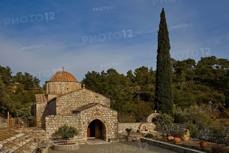 Stone church with cypress in front of a wooded background, Monastery Thari, Moni Thari, near Gadouras reservoir, lonely mountain region, Rhodes, Dodecanese, Greek Islands, Greece, Europe