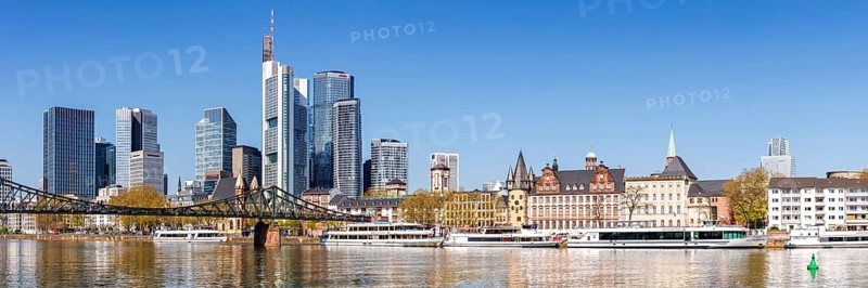 Frankfurt skyline skyscrapers with banks on the river Main panorama with excursion boats and Eiserner Steg in Frankfurt, Germany, Europe