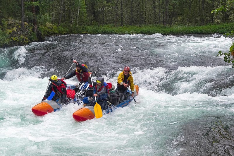 Buryatia, Russia, July 29, 2019: Sports catamaran on the rapids. The Zhom-Bolok River. East Sayan, Buryatia, Siberia, Russia, Europe