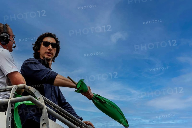Honorary starter, Adam Driver, prepares to drop the green flag for the Indianapolis 500 in Indianapolis, IN, USA, North America