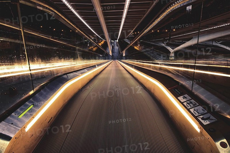 Symmetrical escalator with illuminated handrail in modern surroundings, Liège-Guillemins railway station, Liège-Guillemins, Belgium, Europe