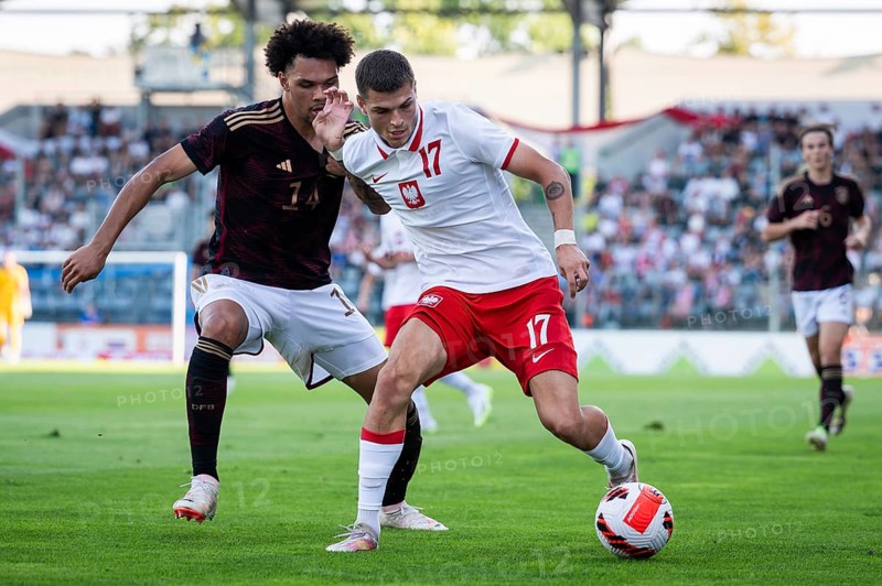 LEGNICA, POLAND - SEPTEMBER 11, 2023: Friendly football match under 20 Elite League Poland vs Germany 1:1. In action Nnamdi Collins (L) Marcel Blachewicz (R).