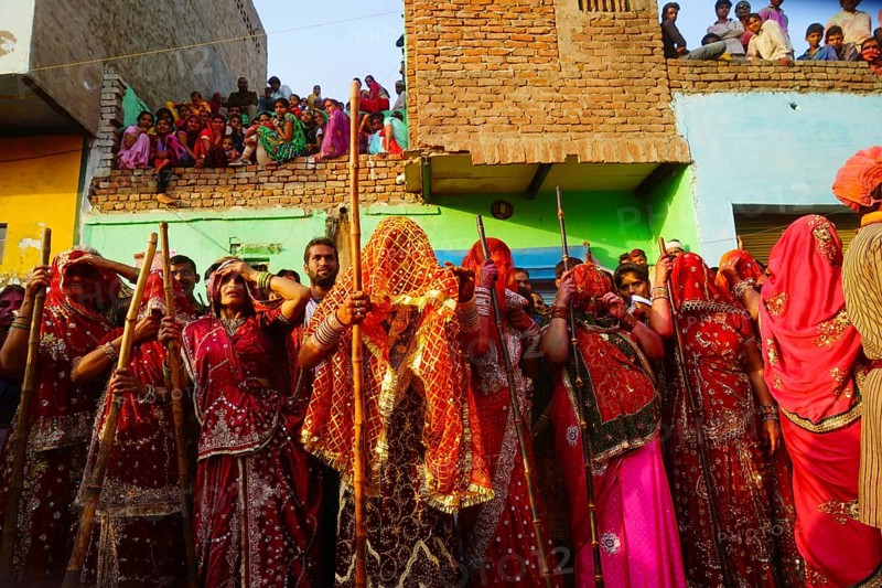 Women with sticks, Lathmar Holi festival, Mathura, Uttar Pradesh, India, Asia