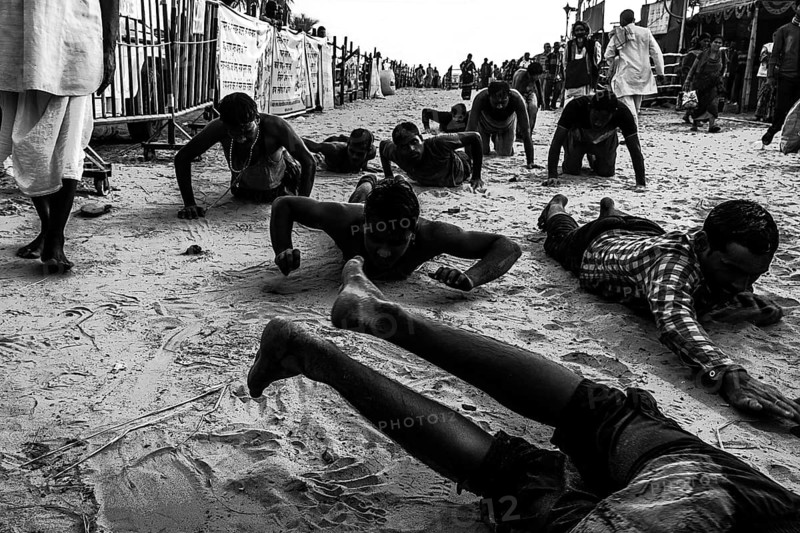 People crawling religious ritual ganga sagar kolkata west bengal India Asia