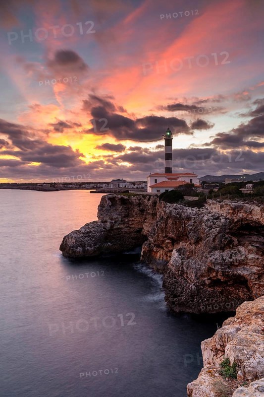 A view of the Portocolom Lighthouse in eastern Mallorca at sunset