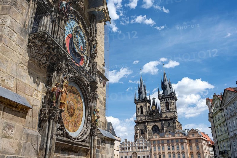 The famous astronomical clock and the Teyn Church in Prague on a sunny day