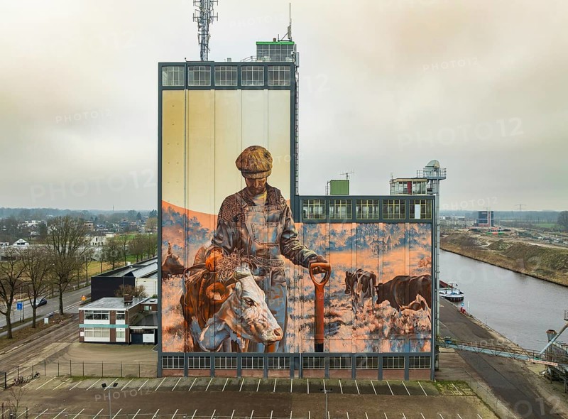 LOCHEM, NETHERLANDS, JANUARY 20, 2024: Artwork on a large building as part of the Achterhoek Silo Art Tour, whereby barns, silos and other agricultural buildings have been transformed into works of art