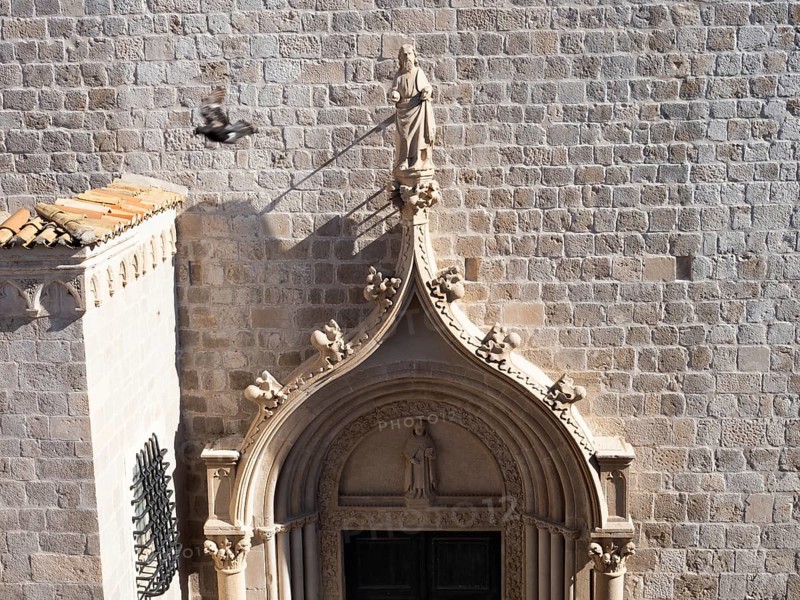 Sculpture, stone carving, figure of a saint above a church portal, Old Town of Dubrovnik, Dalmatia, Croatia, Europe