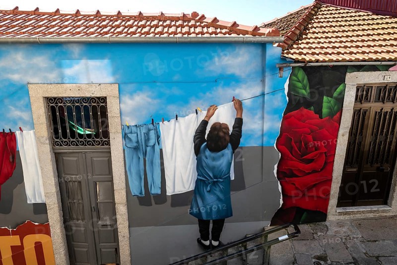 Illusion painting on a house facade in the historic centre, city of Porto, Portugal, Europe