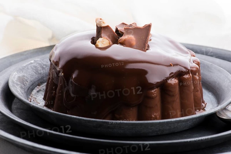 Chocolate pudding with chocolate dressing on a plate