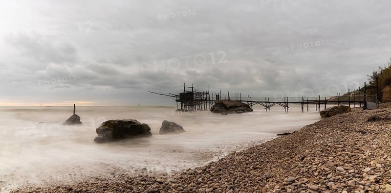 Trabocco Punto Le Morge on a rainy day under a cloudy sky long exposure on the Abruzzo Coast