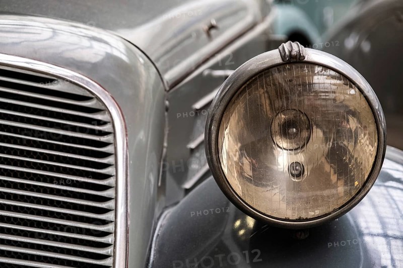 Headlight of old vintage car close-up