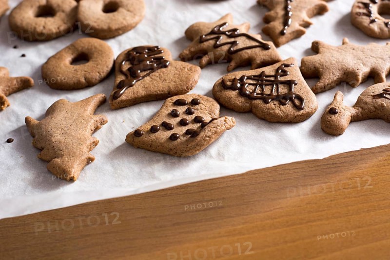Decoration on gingerbread cookie close up. Baking with children