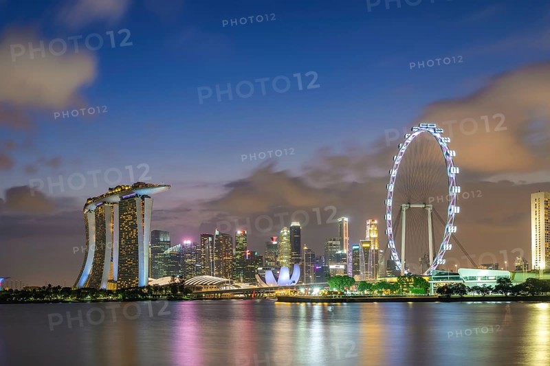 Singapore night city skyline at Marina Bay and Singapore business district