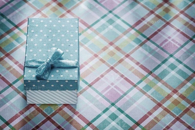 Gift box on checked fabric celebrations concept