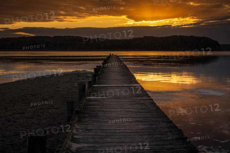 Sunset over the Jasmunder Bodden coast, with the pier in Lietzow, Mecklenburg-Western Pomerania, Germany, Europe