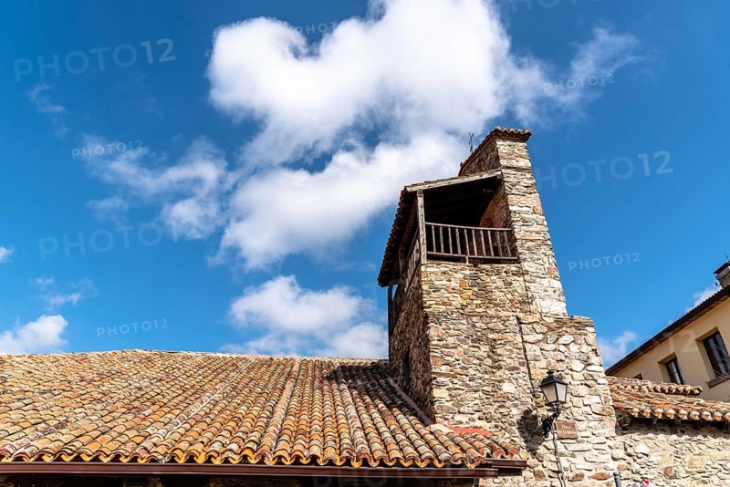 Old stone church in Puebla de la Sierra in the mountain range of Madrid