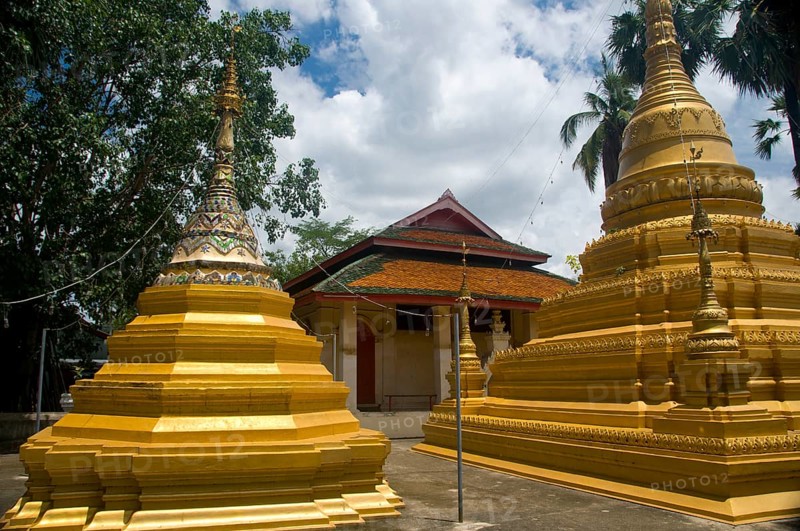 In the south-east corner of Chiang Mai's old city stands Wat Myanmar, a fine example of a 19th century Burmese temple which would not look out of place in Mandalay. This temple is mainly associated with the lowland Burman tradition in the city, and pictures of the Shwedagon Pagoda and Sule Pagoda in Yangon (Rangoon) adorn the walls