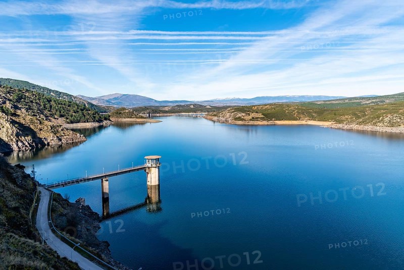 The Atazar reservoir and control tower of Dam in the mountain range of Madrid
