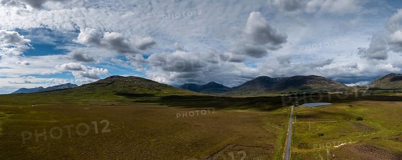 Drone panorama landscape of Connemara National Park and the Twelve Bens mountains in western Ireland