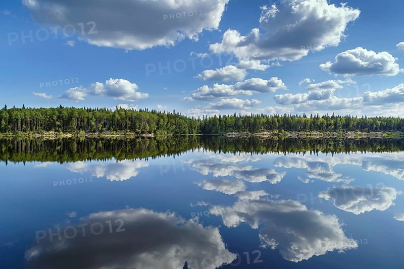 Landscape with a symmetrical reflection on the Vyg river (part of the White Sea-Baltic Canal), Russia, Europe