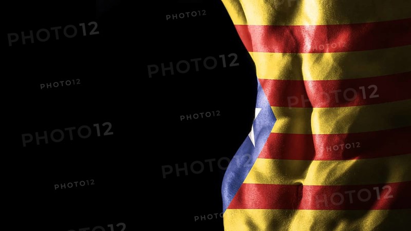 Catalonia flag on abs muscles, national sport workout, bodybuilding concept, black background