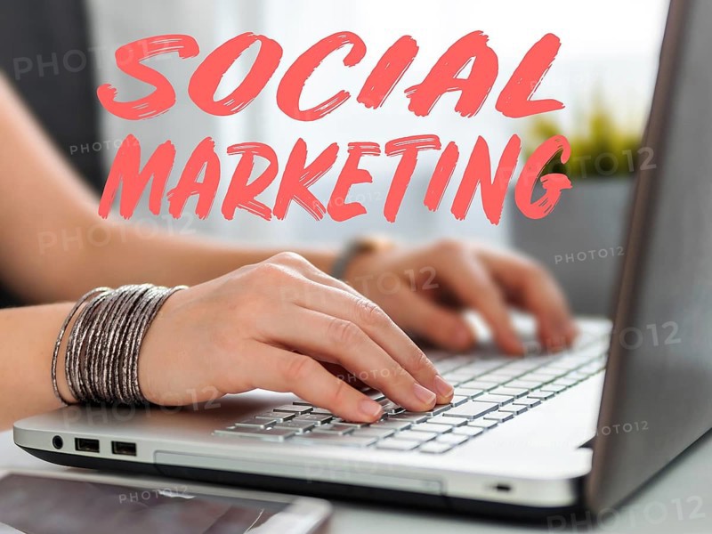 Social marketing concept. Close-up woman's hands using laptop keyboard for social media