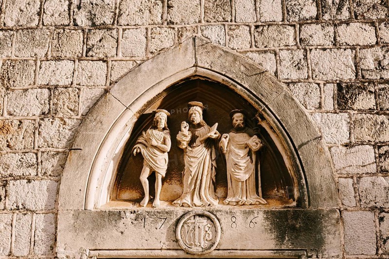 Dubrovnik, Croatia - 04 may 2016: Close-up stone statues, bas-reliefs and high reliefs on the walls of the old city of Dubrovnik, Croatia, Europe