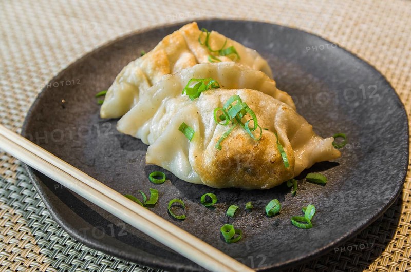Beautiful gyoza or dumplings snack with soy sauce, selective focus, copy space