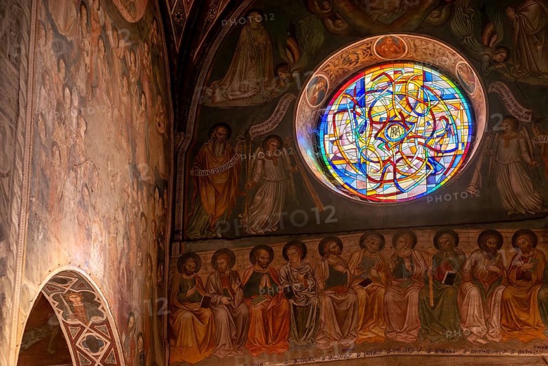 SAN GIMGNANO, ITALY, SEPTEMBER 20, 2023, Colorful old frescoes at the main aisle of the cathedral of San Gimignano