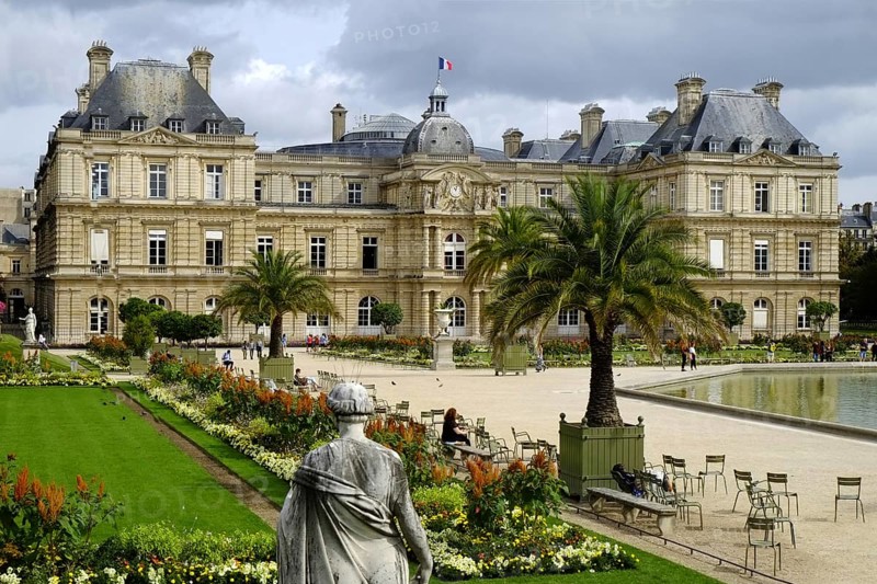 Jardin du Luxembourg in the centre of Paris. In the background the Palais du Luxembourg, in the foreground well-tended flowerbeds and borders. Landscape format. In the background the Palais du Luxembourg, in the foreground well-tended flowerbeds. Horizontal format