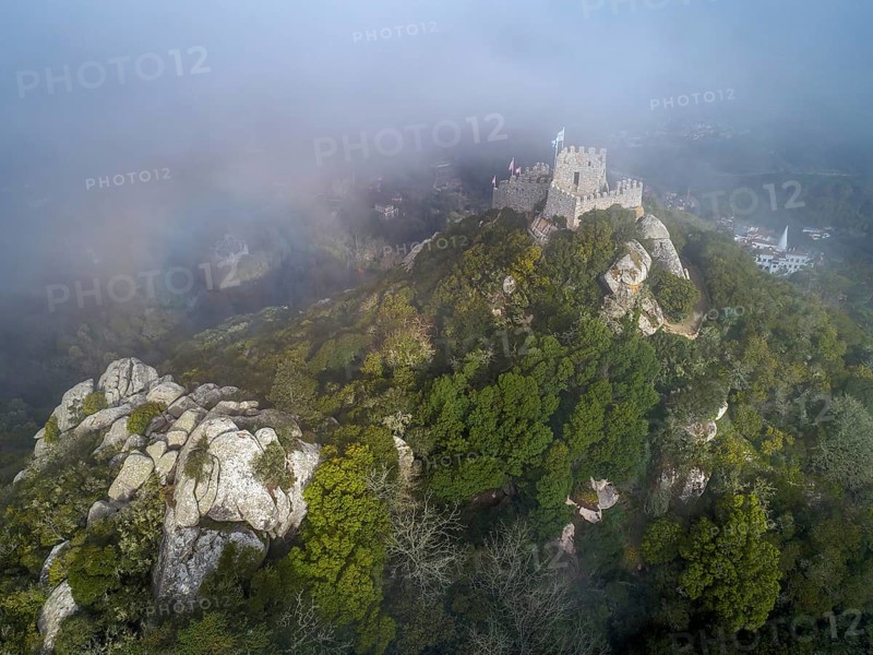 Aerial view of Castelo dos Mouros or Moorish Castle in fog, Sintra, Portugal, Europe