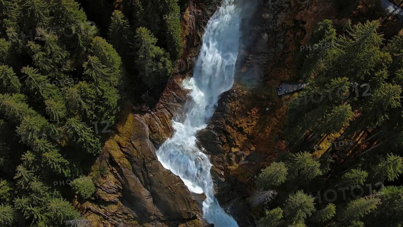 Aerial view of Krimml Waterfalls on sunny day. High Tauern National Park, Austrian Alps, Austria, Europe