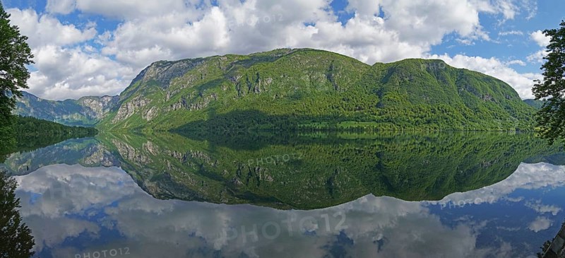 Mountain range reflected in Lake Bohinj, Triglav National Park, Julian Alps, Gorenjska region or Upper Carniola, Slovenia, Europe