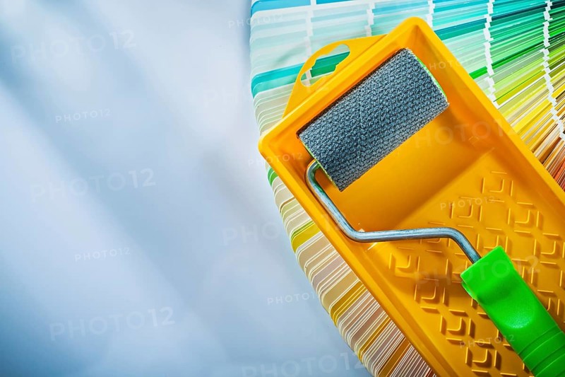 Color sampler paint roller tray on white surface