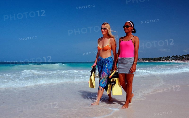 Two snorkellers on the beach, Punta Cana, Caribbean, Dominican Republic, Central America