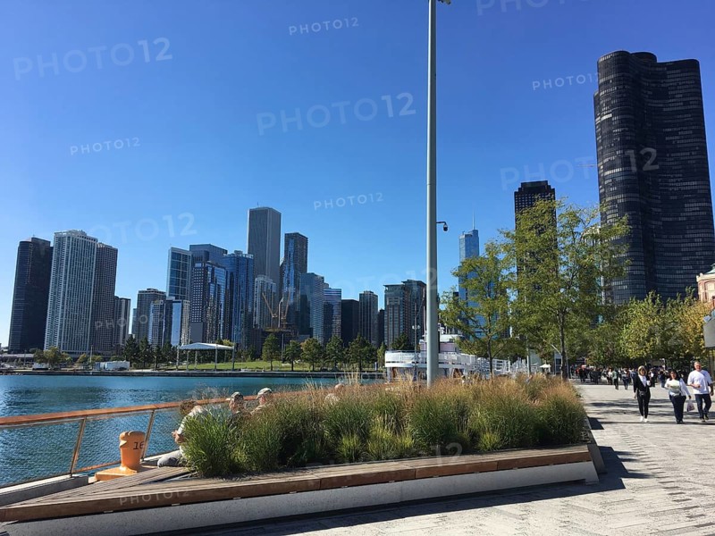 Walkway along the water with a view of modern skyscrapers, chicago, illinois, usa