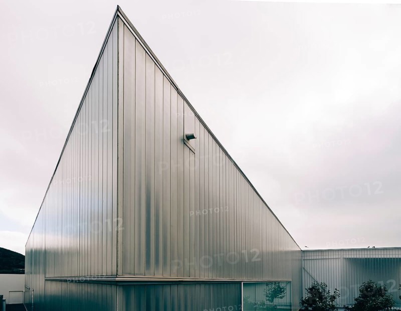 Angra do Heroismo, Portugal, July 1, 2022: New building of modern architecture with U-glass facade containing the Luis da Silva Ribeiro public library, Europe