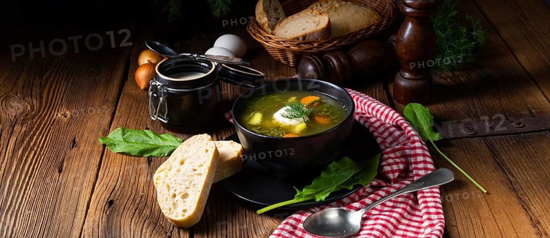 Rustic sorrel soup with potatoes and cream