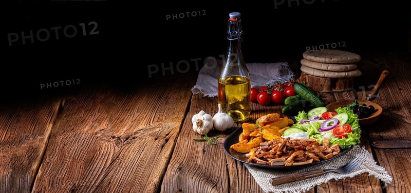 Rustic gyros plate it green salad and potato wedges