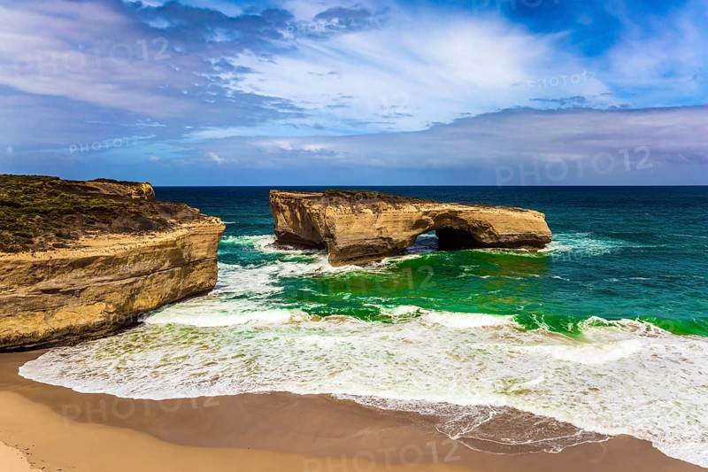 Fantastically picturesque Pacific coast of Australia. White surf foam and azure waves. The concept of exotic, active and photo-tourism