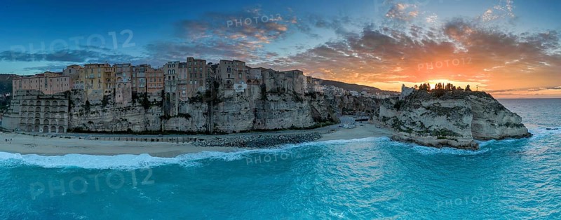 Tropea, Italy, 16 December, 2023: panorama view of Rotonda Beach and the colourful old town of Tropea in Calabria at sunset, Europe