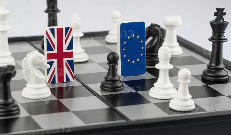 Chess pieces and flags of the European Union and the Britain on a chessboard. The concept of the political game and chess strategy Brexit